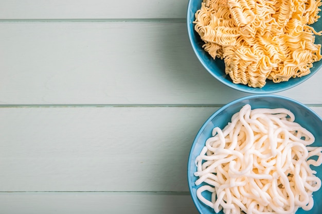 Flat lay noodles in bowls with copy space