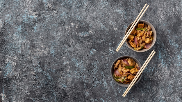 Flat lay noodles in bowls with copy space