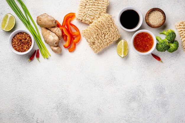 Flat lay noodles and spices mix with copy space