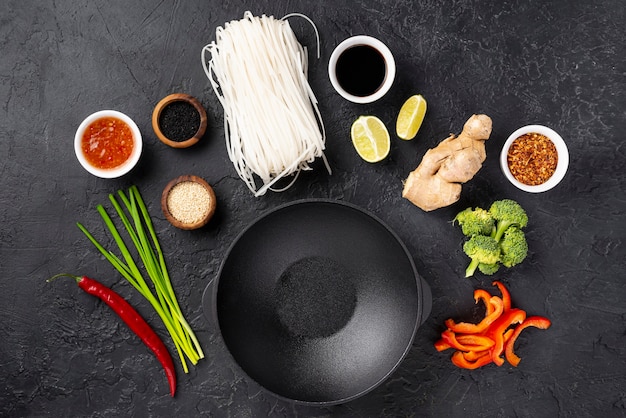 Flat lay noodles and spices with plate