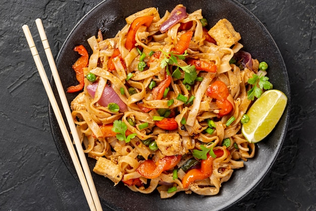 Flat lay noodles with vegetables and chicken