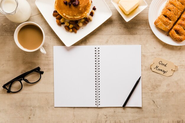 Flat lay notebook with pancakes