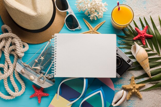Flat lay notebook with vacation concept 