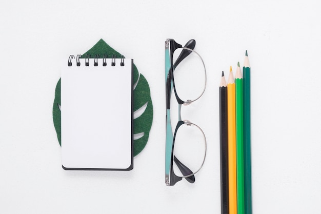 Flat lay of notepad and pencils