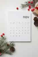 Free photo flat lay november calendar and branches