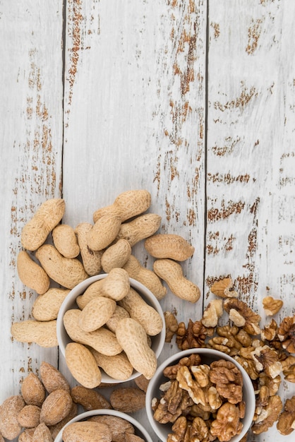Free photo flat lay of nuts arrangement with copy space