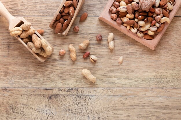 Flat lay of nuts arrangement on wooden table