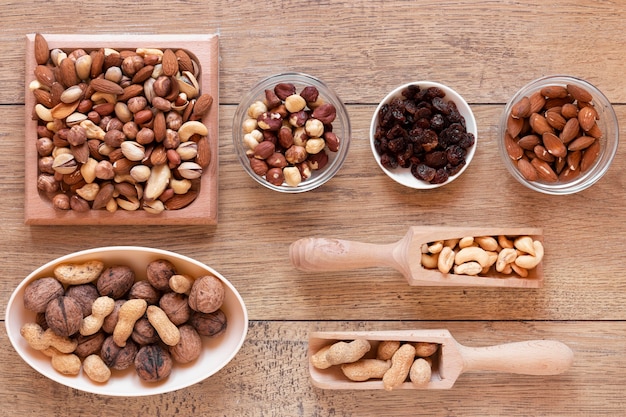 Free photo flat lay of nuts arrangement on wooden table