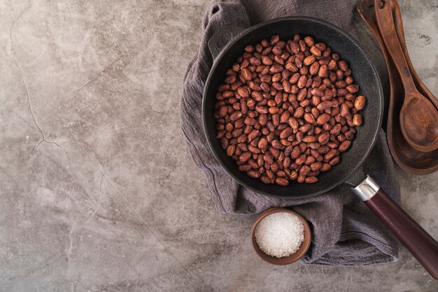 Flat lay of nuts in pan with copy space