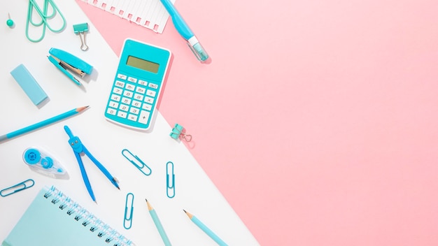 Flat lay of office stationery with compass and calculator