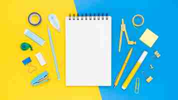 Free photo flat lay of office stationery with eraser and stapler