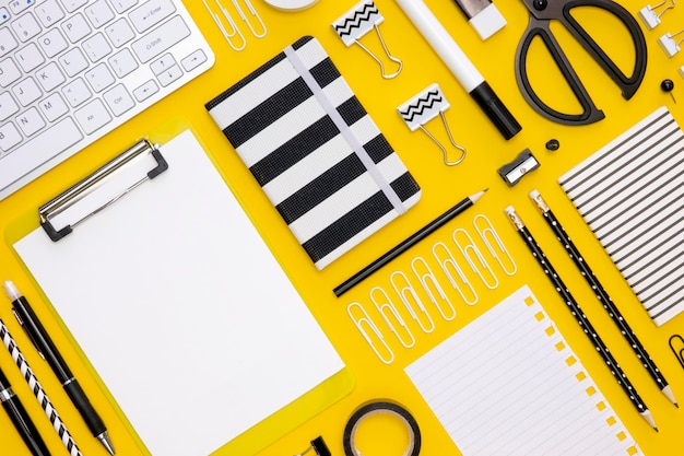 Flat lay of office stationery with pencils and keyboard