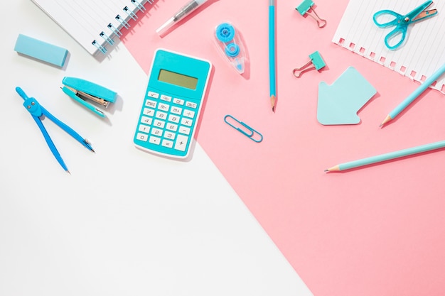 Free photo flat lay of office stationery with stapler and calculator