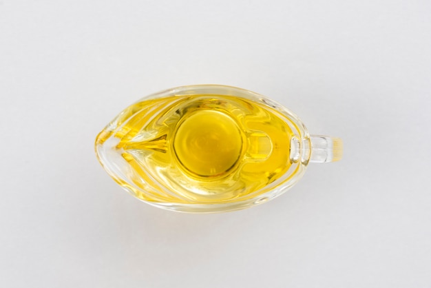 Flat lay olive oil cup on table