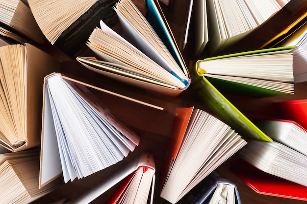 Flat lay opened books on table