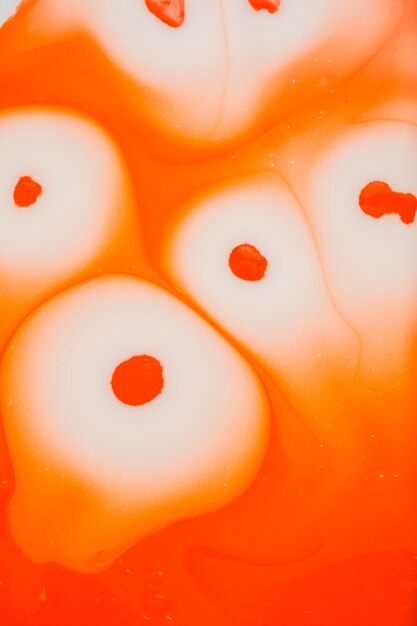 Flat lay orange liquid wallpaper