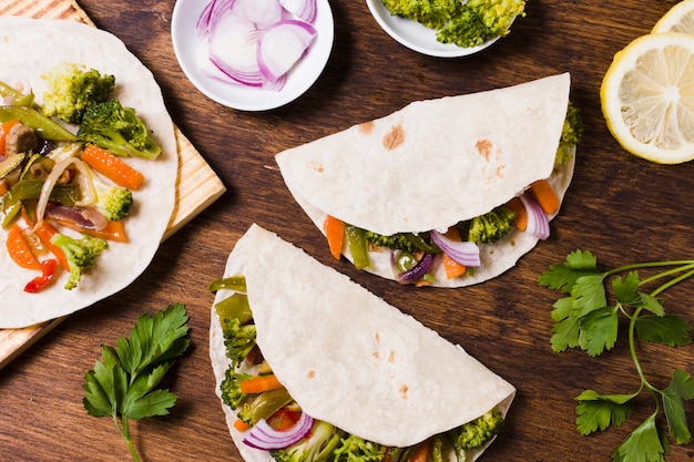 Free photo flat lay of organic vegetables wrapped in pita