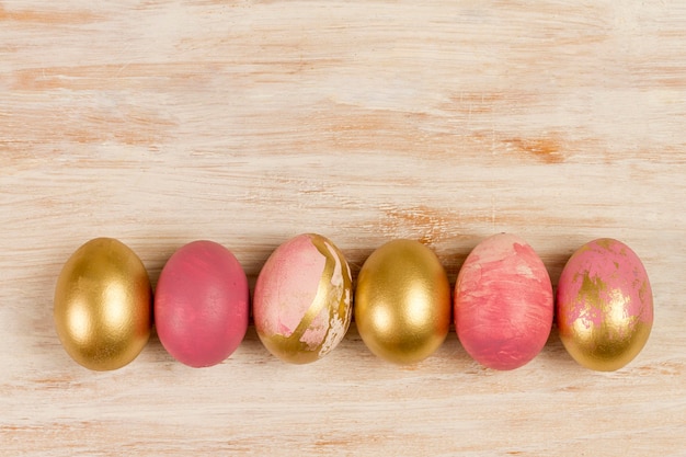 Flat lay of painted eggs for easter with copy space