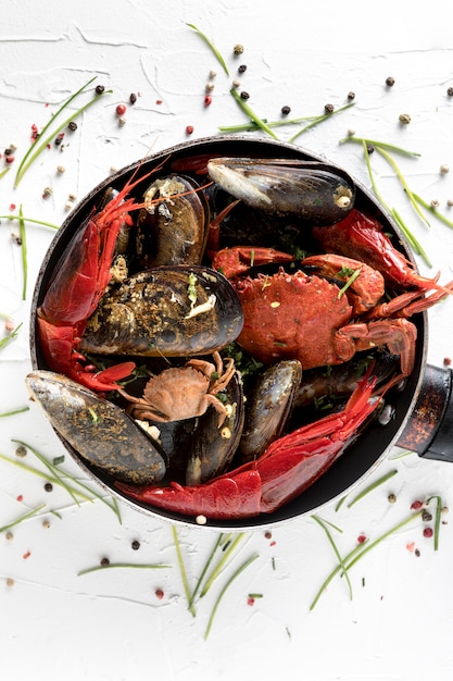 Flat lay of pan with crab and mussels