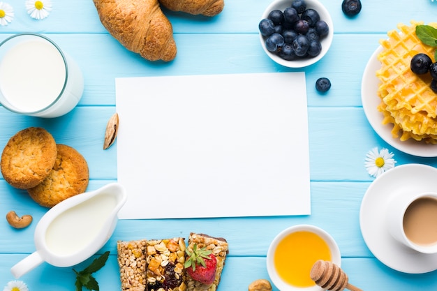 Flat lay paper card mockup on breakfast table