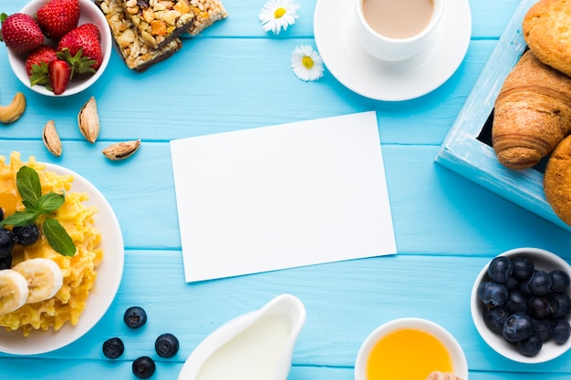 Flat lay paper card mockup on breakfast table