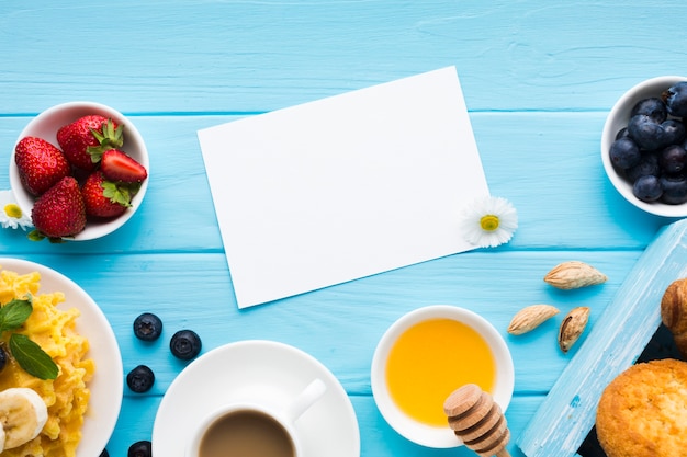 Free photo flat lay paper card mockup on breakfast table