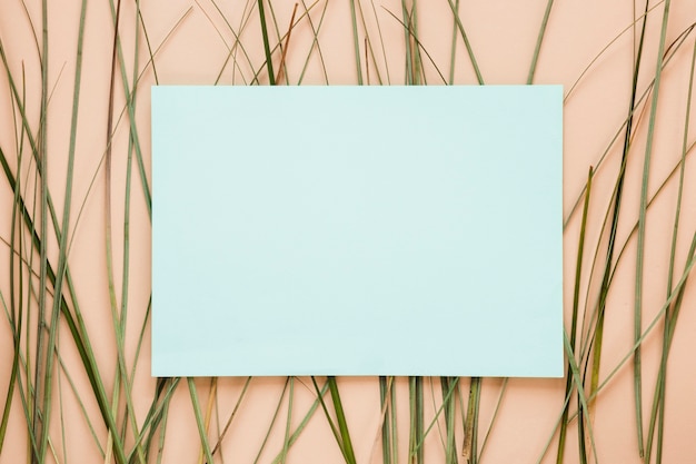 Free photo flat lay of paper card template with leaves