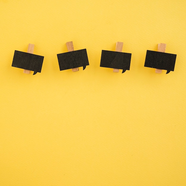 Free photo flat lay of paper clips on yellow background