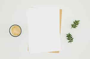 Free photo flat lay paper mockup with floral elements