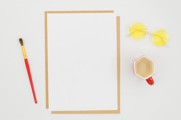 Flat lay paper mockup on workspace