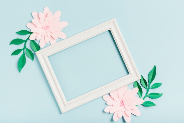 Flat lay of paper spring flowers with frame