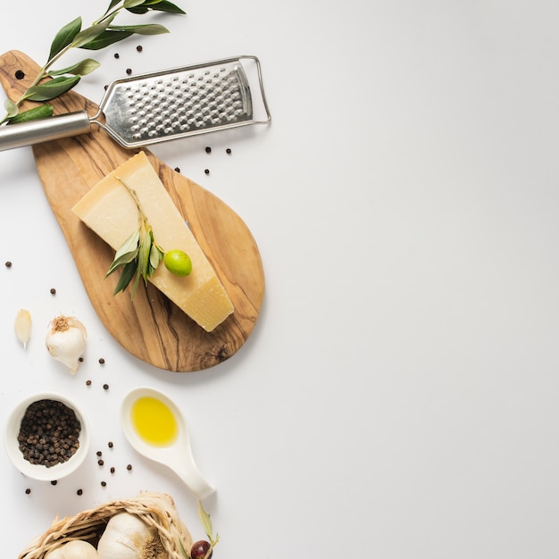 Flat lay parmesan on cutting board with copy space