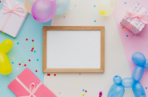 Flat lay party decoration with balloons and confetti