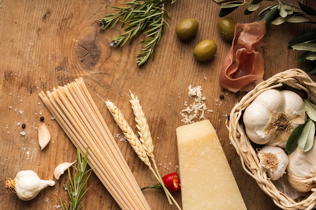 Free photo flat lay pasta ingredients on table