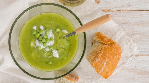 Flat lay pea soup with bread
