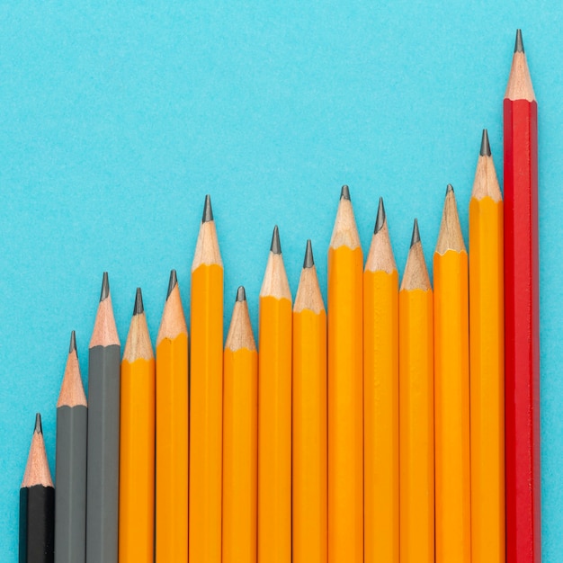 Flat lay pencils on blue background