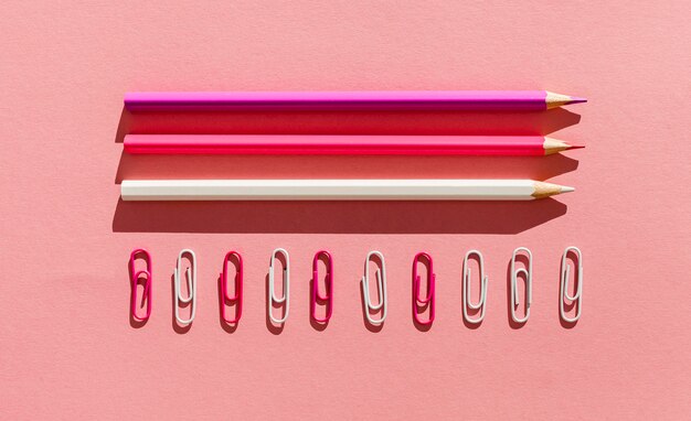 Flat lay pencils and paper clips