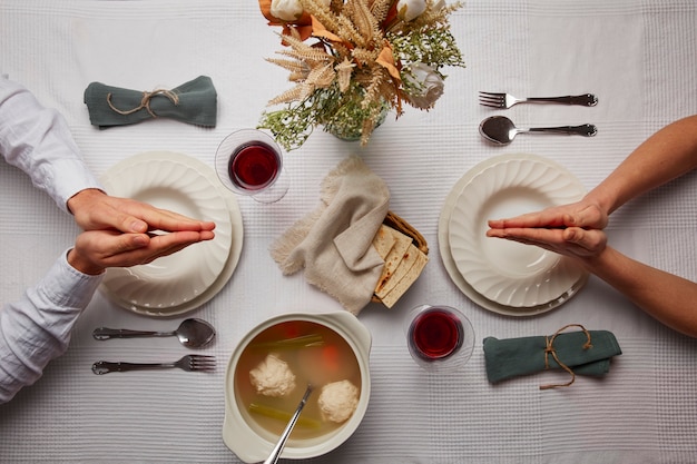 Free photo flat lay of people having a feast for the first day of passover seder