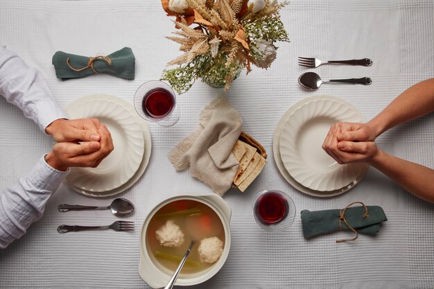 flat lay of people having a feast for the first day of passover seder