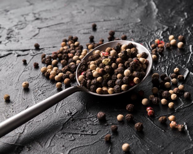 Flat lay peppercorns on spoon