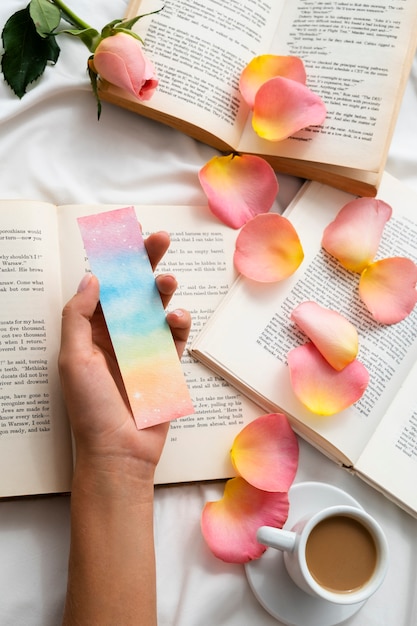 Flat lay petals on books arrangement