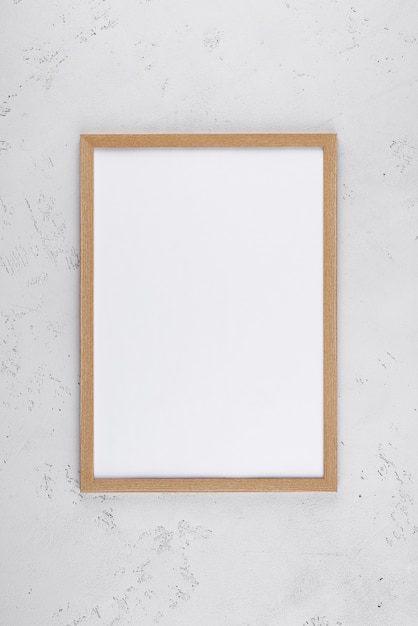 Flat lay of photo frame on textured surface