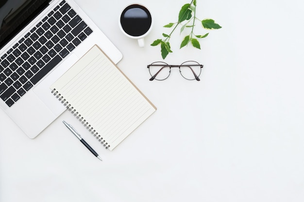 Flat lay photo of office desk with laptop copy space background