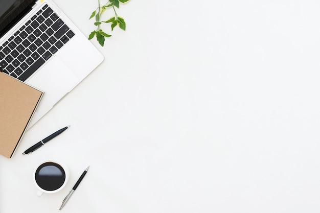 Flat lay photo of office desk with laptop copy space background