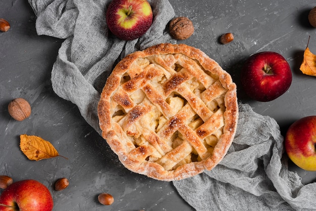 Flat lay of pie and apples