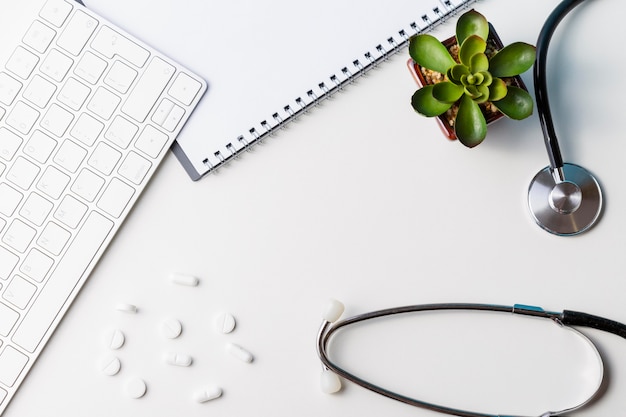 Flat lay pills with keyboard