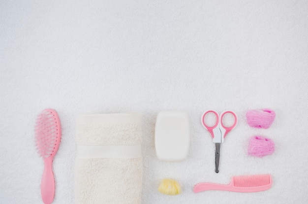 Flat lay pink bath accessories for baby