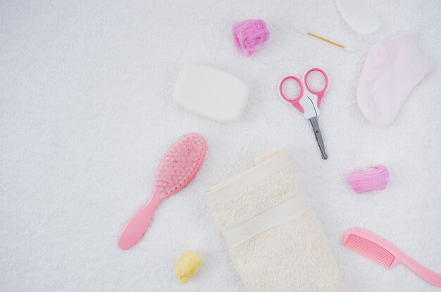 Flat lay pink bath accessories for baby