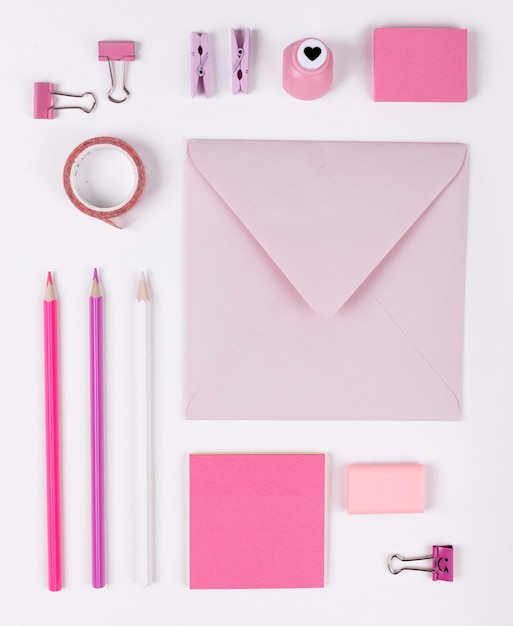 Flat lay pink items arrangement