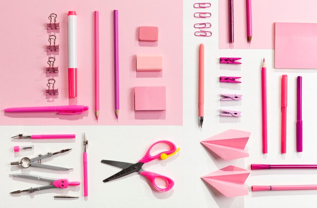 Free photo flat lay pink items arrangement